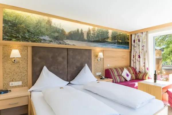 Landhaus Deluxe Zimmer - Schlafzimmer mit Doppelbett